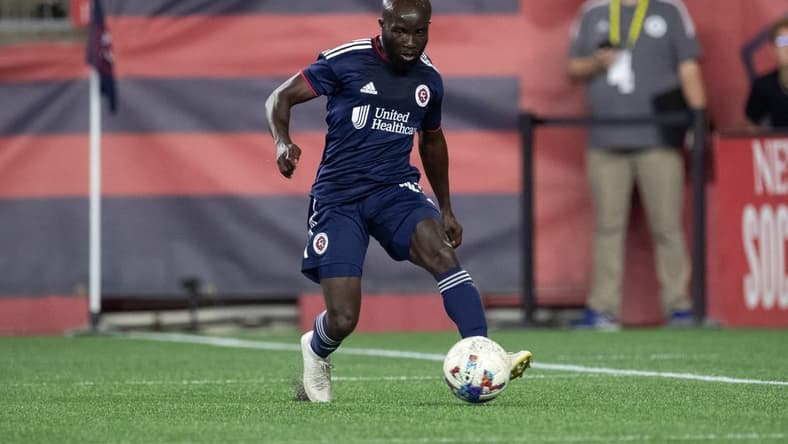 Aug 31, 2022; Foxborough, Massachusetts, USA; New England Revolution midfielder Emmanuel Boateng (11) passes the ball during the second half against the Chicago Fire FC at Gillette Stadium. Mandatory Credit: Paul Rutherford-USA TODAY Sports