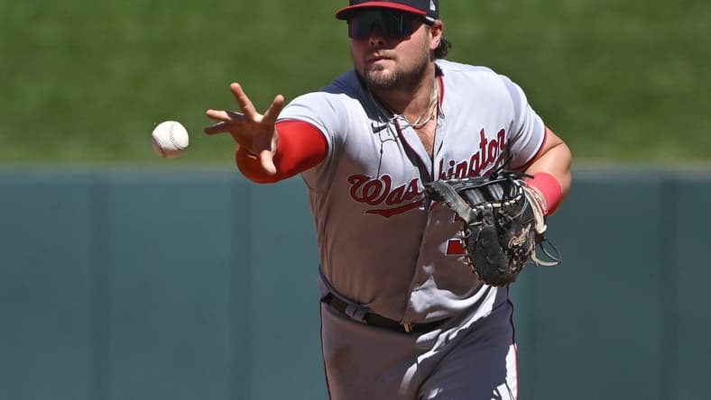 Sep 8, 2022; St. Louis, Missouri, USA; Washington Nationals first baseman Luke Voit (34) flips to first base after fielding a ground ball against the St. Louis Cardinals during the fifth inning at Busch Stadium. Mandatory Credit: Jeff Curry-USA TODAY Sports