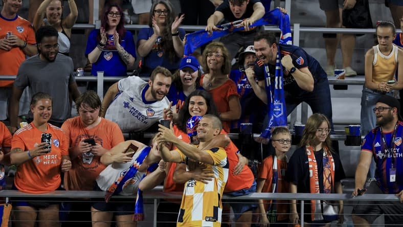 Sep 10, 2022; Cincinnati, Ohio, USA; FC Cincinnati defender Nick Hagglund (4) celebrates with fans after defeating the San Jose Earthquakes at TQL Stadium. Mandatory Credit: Aaron Doster-USA TODAY Sports