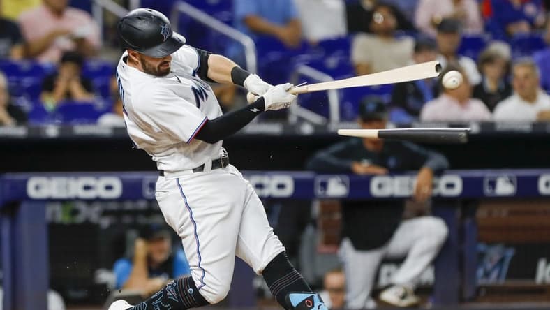 Sep 21, 2022; Miami, Florida, USA; Miami Marlins left fielder Jon Berti (5) breaks his bat during the third inning against the Chicago Cubs at loanDepot Park. Mandatory Credit: Sam Navarro-USA TODAY Sports