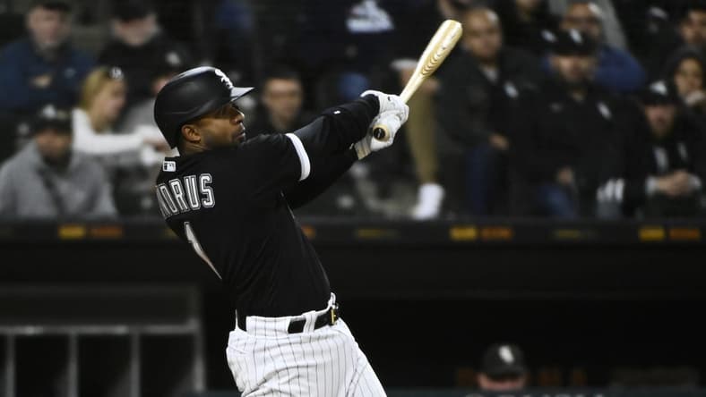 Oct 4, 2022; Chicago, Illinois, USA; Chicago White Sox shortstop Elvis Andrus (1) singles against the Minnesota Twins during the third inning at Guaranteed Rate Field. Mandatory Credit: Matt Marton-USA TODAY Sports