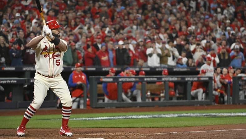Oct 8, 2022; St. Louis, Missouri, USA; St. Louis Cardinals designated hitter Albert Pujols (5) awaits a pitch in the eighth inning against the Philadelphia Phillies during game two of the Wild Card series for the 2022 MLB Playoffs at Busch Stadium. Mandatory Credit: Jeff Curry-USA TODAY Sports