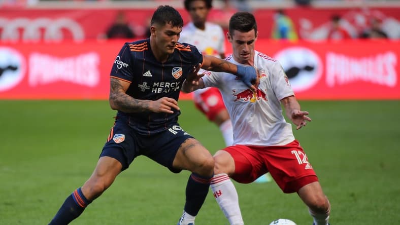 Oct 15, 2022; Harrison, New Jersey, USA;  FC Cincinnati forward Brandon Vazquez (19) controls the ball against New York Red Bulls defender Dylan Nealis (12) during the second half at Red Bull Arena. Mandatory Credit: Wendell Cruz-USA TODAY Sports