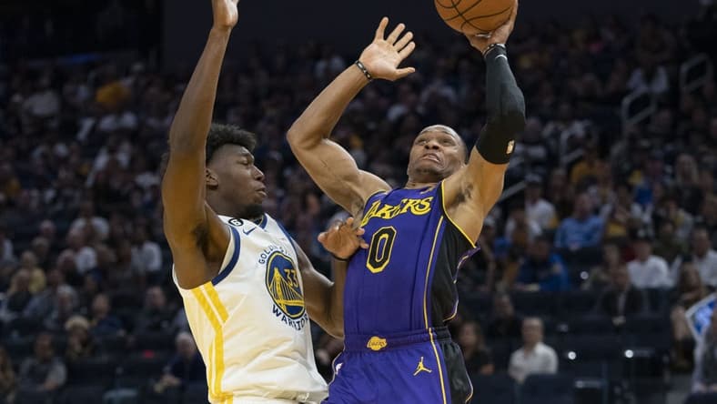 October 18, 2022; San Francisco, California, USA; Los Angeles Lakers guard Russell Westbrook (0) shoots the basketball against Golden State Warriors center James Wiseman (33) during the third quarter at Chase Center. Mandatory Credit: Kyle Terada-USA TODAY Sports