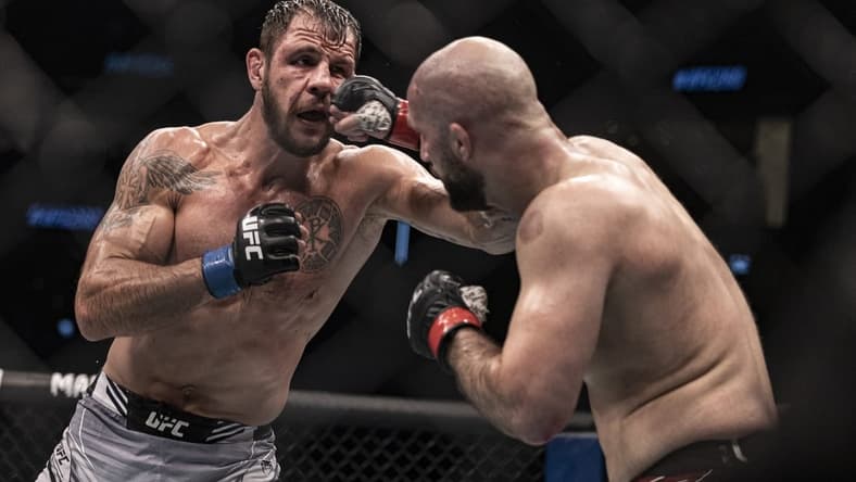 Oct 22, 2022; Abu Dhabi, UAE; Volkan Oezdemir (red gloves) and Nikita Krylov (blue gloves) during UFC 280 at Etihad Arena. Mandatory Credit: Craig Kidwell-USA TODAY Sports