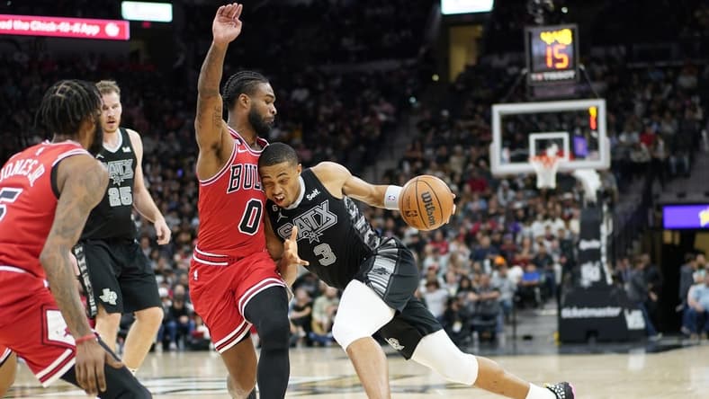 Oct 28, 2022; San Antonio, Texas, USA; San Antonio Spurs forward Keldon Johnson (3) drives to the basket against the Chicago Bulls guard Coby White (00) during the second half at AT&T Center. Mandatory Credit: Scott Wachter-USA TODAY Sports
