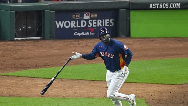 Nov 5, 2022; Houston, Texas, USA; Houston Astros left fielder Yordan Alvarez (44) flips his bat after he hits a three run home run against the Philadelphia Phillies during the sixth inning in game six of the 2022 World Series at Minute Maid Park. Mandatory Credit: Jerome Miron-USA TODAY Sports