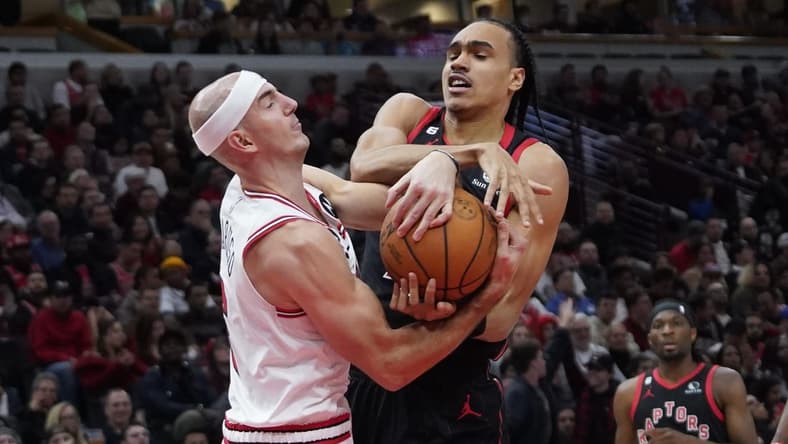 Nov 7, 2022; Chicago, Illinois, USA; Toronto Raptors guard Dalano Banton (45) and Chicago Bulls guard Alex Caruso (6) go for the ball during the second half at United Center. Mandatory Credit: David Banks-USA TODAY Sports