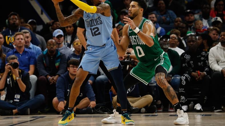 Nov 7, 2022; Memphis, Tennessee, USA; Memphis Grizzlies guard Ja Morant (12) and Boston Celtics forward Jayson Tatum (0) during the second half at FedExForum. Mandatory Credit: Petre Thomas-USA TODAY Sports