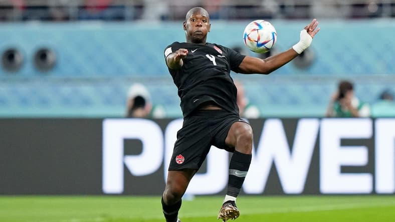 Nov 27, 2022; Doha, Qatar; (Editors Note: Caption Correction) Canada defender Kamal Miller (4) controls the ball against Croatia during the second half of a group stage match during the 2022 World Cup at Khalifa International Stadium. Mandatory Credit: Danielle Parhizkaran-USA TODAY Sports