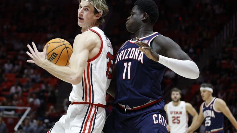 Dec 1, 2022; Salt Lake City, Utah, USA; Utah Utes center Branden Carlson (35) looks to drive against Arizona Wildcats center Oumar Ballo (11) in the second half at Jon M. Huntsman Center. Mandatory Credit: Jeffrey Swinger-USA TODAY SportsDec 1, 2022; Salt Lake City, Utah, USA; at Jon M. Huntsman Center. Mandatory Credit: Jeffrey Swinger-USA TODAY Sports