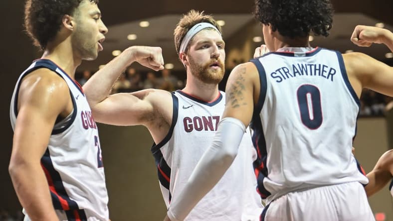 Dec 2, 2022; Sioux Falls, South Dakota, USA; Gonzaga Bulldogs guard Julian Strawther (0) reacts with forward Drew Timme (2) and forward Anton Watson (22) after a basket against the Baylor Bears in the second half at Sanford Pentagon. Mandatory Credit: Steven Branscombe-USA TODAY Sports