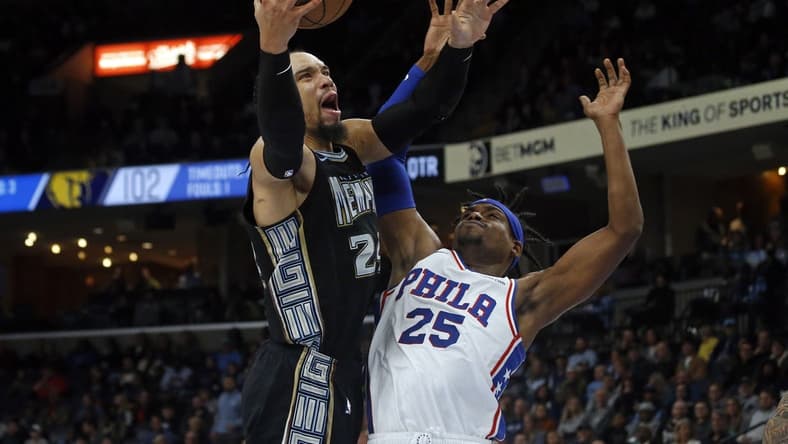 Dec 2, 2022; Memphis, Tennessee, USA; Memphis Grizzlies forward Dillon Brooks (24) drives to the basket as Philadelphia 76ers forward Danuel House Jr. (25) defends during the second half at FedExForum. Mandatory Credit: Petre Thomas-USA TODAY Sports