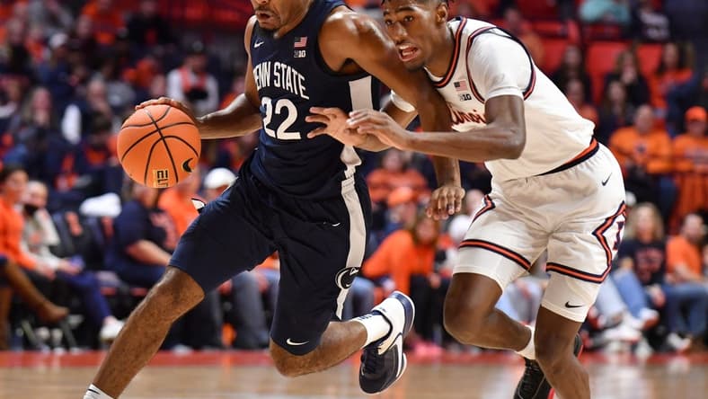 Dec 10, 2022; Champaign, Illinois, USA; Penn State Nittany Lions guard Jalen Pickett (22) moves the ball past Illinois Fighting Illini guard Sencire Harris (1) during the second half at State Farm Center. Mandatory Credit: Ron Johnson-USA TODAY Sports