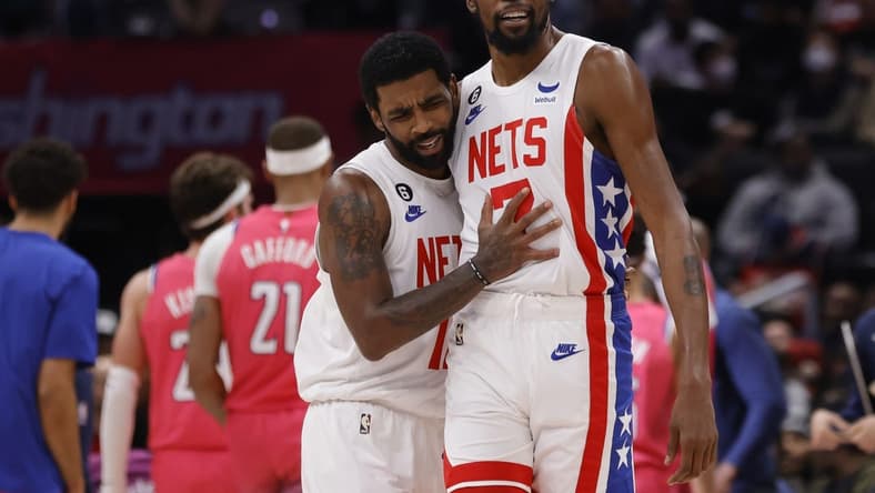 Dec 12, 2022; Washington, District of Columbia, USA; Brooklyn Nets guard Kyrie Irving (11) celebrates with Nets forward Kevin Durant (7) against the Washington Wizards in the fourth quarter at Capital One Arena. Mandatory Credit: Geoff Burke-USA TODAY Sports