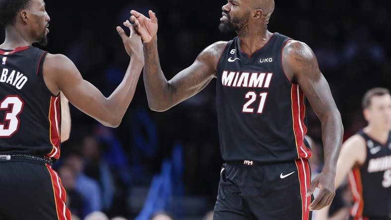 Dec 14, 2022; Oklahoma City, Oklahoma, USA; Miami Heat center Dewayne Dedmon (21) high fives center Bam Adebayo (13) between plays against the Oklahoma City Thunder during the second quarter at Paycom Center. Mandatory Credit: Alonzo Adams-USA TODAY Sports