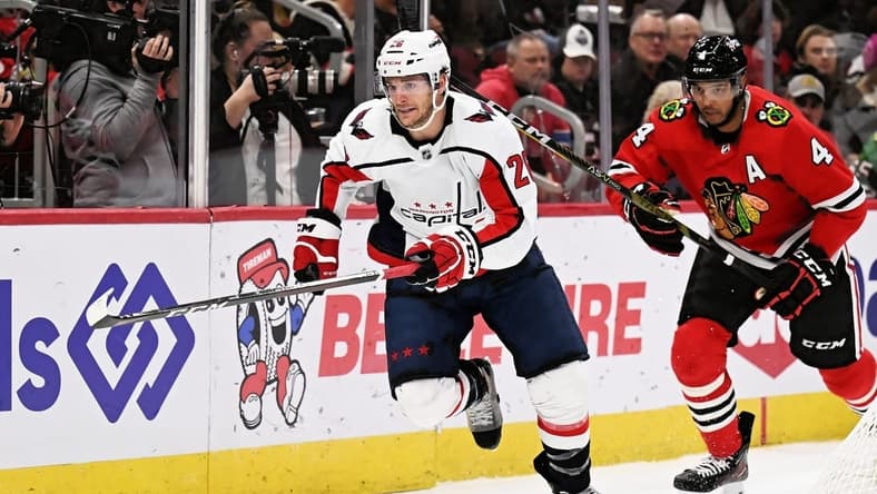 Dec 13, 2022; Chicago, Illinois, USA; Washington Capitals forward Nic Dowd (26) skates against the Chicago Blackhawks at United Center. Mandatory Credit: Jamie Sabau-USA TODAY Sports