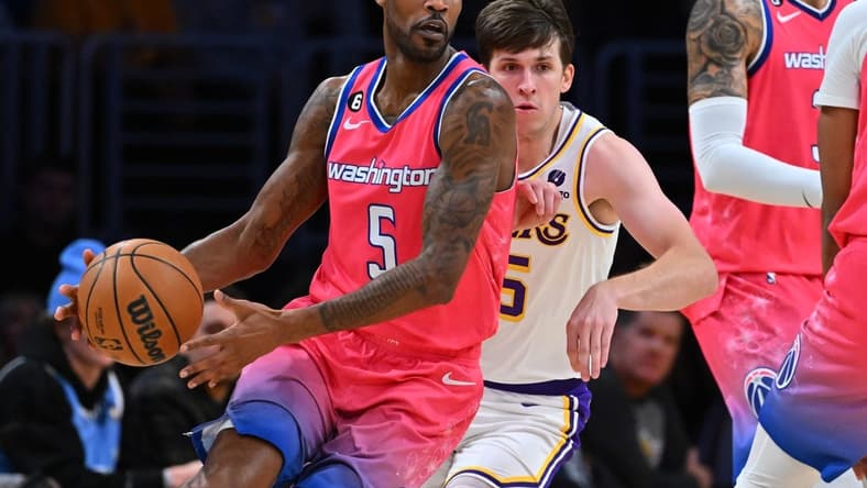 Dec 18, 2022; Los Angeles, California, USA; Los Angeles Lakers guard Austin Reaves (15) chases down Washington Wizards forward Will Barton (5) in the first half at Crypto.com Arena. Mandatory Credit: Jayne Kamin-Oncea-USA TODAY Sports
