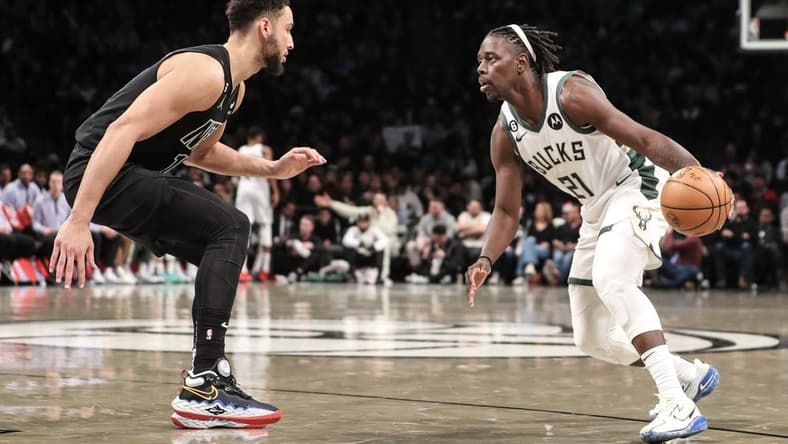 Dec 23, 2022; Brooklyn, New York, USA;  Milwaukee Bucks guard Jrue Holiday (21) looks to drive past Brooklyn Nets guard Ben Simmons (10) in the second quarter at Barclays Center. Mandatory Credit: Wendell Cruz-USA TODAY Sports