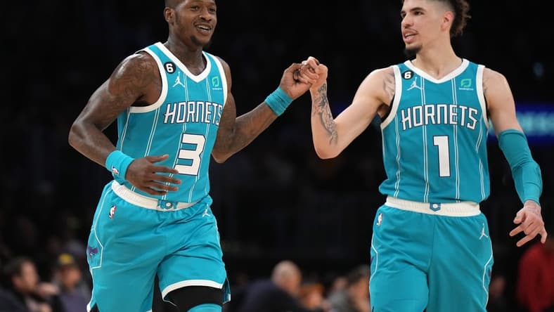 Dec 23, 2022; Los Angeles, California, USA; Charlotte Hornets guard Terry Rozier (3) celebrates with guard LaMelo Ball (1) after a three-point basket in the second half against the Los Angeles Lakers at Crypto.com Arena. The Hornets defeated the Lakers 134-130. Mandatory Credit: Kirby Lee-USA TODAY Sports