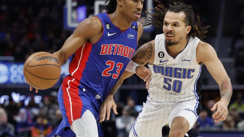 Dec 28, 2022; Detroit, Michigan, USA; Detroit Pistons guard Jaden Ivey (23) dribbles on Orlando Magic guard Cole Anthony (50) in the second half at Little Caesars Arena. Mandatory Credit: Rick Osentoski-USA TODAY Sports