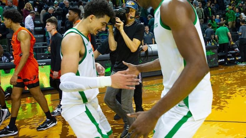 Oregon's Will Richardson, left, is congratulated by N'Faly Dante after leading the Ducks to a win over Oregon State at Matthew Knight Arena Saturday, Dec 31, 2022 in Eugene, Oregon, USA.

Ncaa Basketball Oregon Vs Osu Oregon State At Oregon
