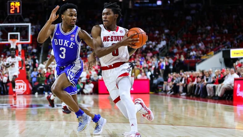 Jan 4, 2023; Raleigh, North Carolina, USA;  North Carolina State Wolfpack guard Terquavion Smith (0) runs with the ball guarded by guard Jeremy Roach (3) during the first half against Duke Blue Devils at at PNC Arena. Mandatory Credit: Jaylynn Nash-USA TODAY Sports