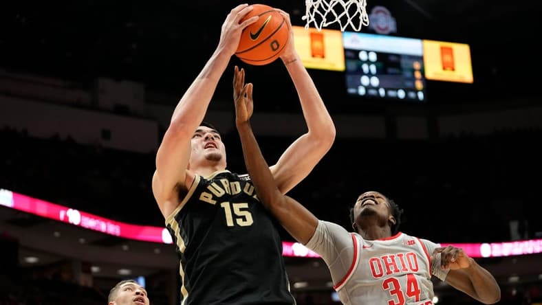 Jan 5, 2023; Columbus, OH, USA; Purdue Boilermakers center Zach Edey (15) grabs a rebound over Ohio State Buckeyes center Felix Okpara (34) during the NCAA men's basketball game at Value City Arena. Purdue won 71-69. Mandatory Credit: Adam Cairns-The Columbus Dispatch
Basketball Purdue At Ohio State