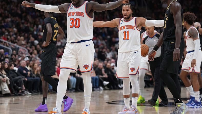 Jan 6, 2023; Toronto, Ontario, CAN; New York Knicks forward Julius Randle (30) and New York Knicks guard Jalen Brunson (11) react against the Toronto Raptors during the second quarter at Scotiabank Arena. Mandatory Credit: Nick Turchiaro-USA TODAY Sports
