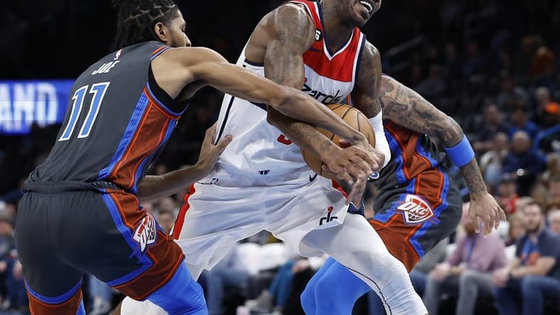 Jan 6, 2023; Oklahoma City, Oklahoma, USA; Washington Wizards forward Will Barton (5) drives against Oklahoma City Thunder guard Isaiah Joe (11) during the second half at Paycom Center. Mandatory Credit: Alonzo Adams-USA TODAY Sports