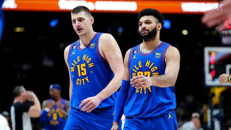Jan 6, 2023; Denver, Colorado, USA; Denver Nuggets center Nikola Jokic (15) and guard Jamal Murray (27) during the second half at Ball Arena. Mandatory Credit: Ron Chenoy-USA TODAY Sports
