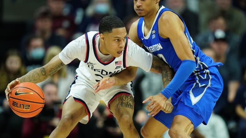 Jan 7, 2023; Storrs, Connecticut, USA; UConn Huskies guard Jordan Hawkins (24) dribbles the ball against Creighton Bluejays guard Trey Alexander (23) in the second half at Harry A. Gampel Pavilion. Mandatory Credit: David Butler II-USA TODAY Sports
