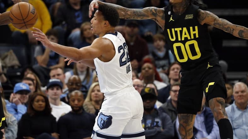Jan 8, 2023; Memphis, Tennessee, USA; Memphis Grizzlies guard Desmond Bane (22) passes the ball as Utah Jazz guard Jordan Clarkson (00) defends during the second half at FedExForum. Mandatory Credit: Petre Thomas-USA TODAY Sports