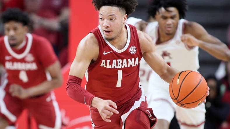 Jan 11, 2023; Fayetteville, Arkansas, USA; Alabama Crimson Tide guard Mark Sears (1) leads a fast break in the second half against the Arkansas Razorbacks at Bud Walton Arena. Alabama won 84-69. Mandatory Credit: Nelson Chenault-USA TODAY Sports