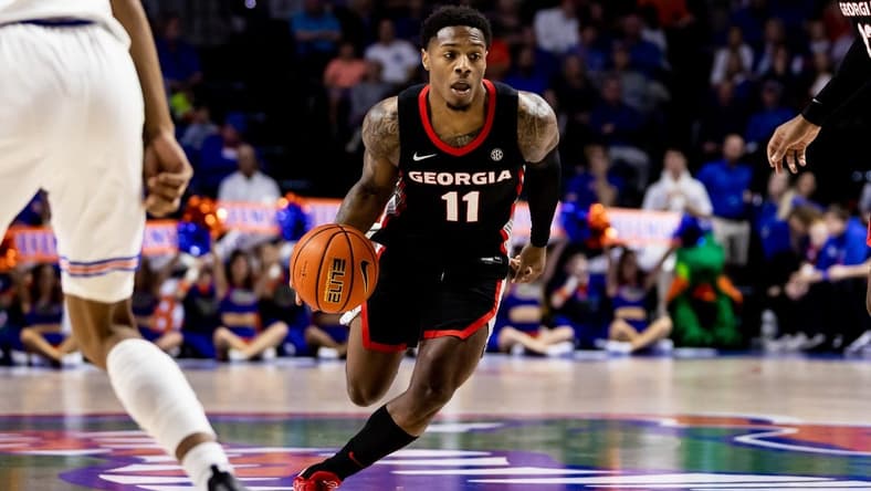Jan 7, 2023; Gainesville, Florida, USA; Georgia Bulldogs guard Justin Hill (11) drives to the basket during the first half against the Florida Gators at Exactech Arena at the Stephen C. O'Connell Center. Mandatory Credit: Matt Pendleton-USA TODAY Sports