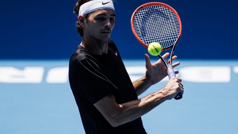 Jan 13, 2023; Melbourne, Victoria, Australia; Taylor Fritz of the United States hits a shot during a practice session on Margaret Court Arena at Melbourne Park. Mandatory Credit: Mike Frey-USA TODAY Sports