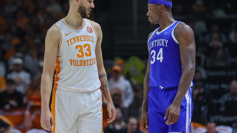 Jan 14, 2023; Knoxville, Tennessee, USA; Tennessee Volunteers forward Uros Plavsic (33) and Kentucky Wildcats forward Oscar Tshiebwe (34) during the second half at Thompson-Boling Arena. Mandatory Credit: Randy Sartin-USA TODAY Sports