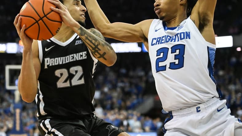 Jan 14, 2023; Omaha, Nebraska, USA; Creighton Bluejays guard Trey Alexander (23) defends against Providence Friars guard Devin Carter (22) in the second half at CHI Health Center Omaha. Mandatory Credit: Steven Branscombe-USA TODAY Sports