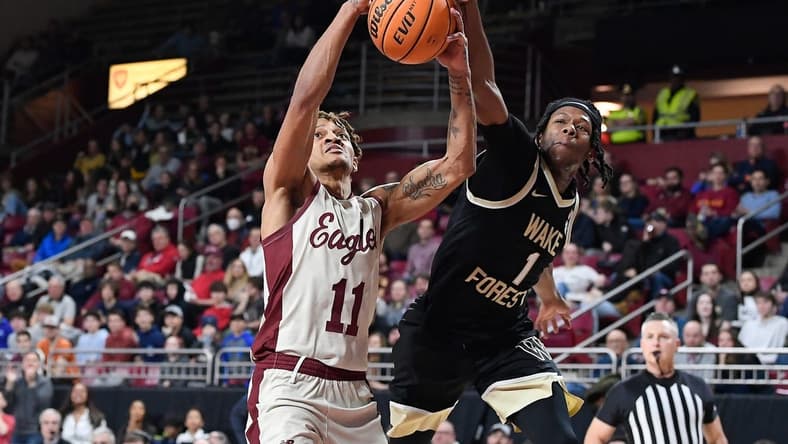 Jan 14, 2023; Chestnut Hill, Massachusetts, USA; Wake Forest Demon Deacons guard Tyree Appleby (1) strips the ball from Boston College Eagles guard Makai Ashton-Langford (11) during the second half at Conte Forum. Mandatory Credit: Eric Canha-USA TODAY Sports