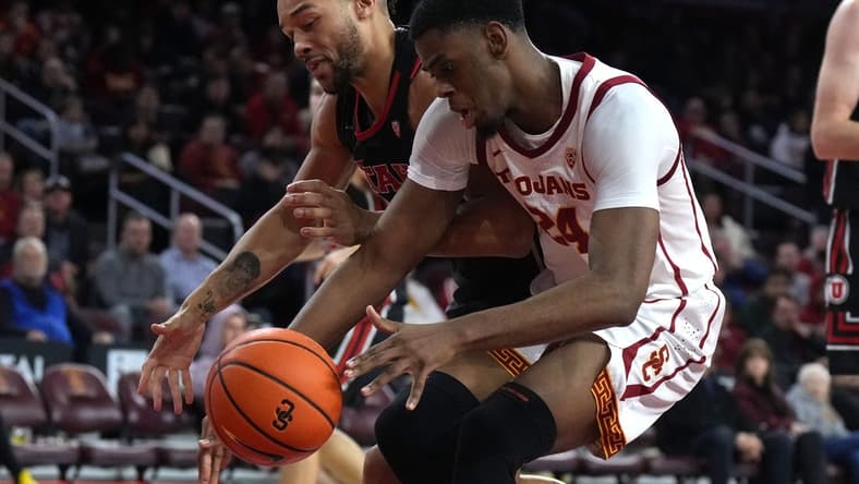 January 14, 2023; Los Angeles, California, USA; Utah Utes guard Marco Anthony (10) and Southern California Trojans forward Joshua Morgan (24) reach for the ball in the second half at Galen Center. Mandatory Credit: Kirby Lee-USA TODAY Sports