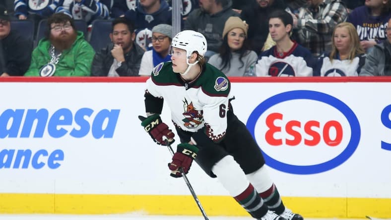 Jan 15, 2023; Winnipeg, Manitoba, CAN;  Arizona Coyotes defenseman Jakob Chychrun (6) looks to make a pass against the Winnipeg Jets during the second period at Canada Life Centre. Mandatory Credit: Terrence Lee-USA TODAY Sports