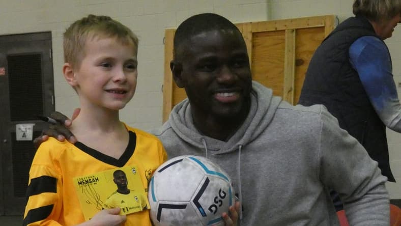 Jonathan Mensah, Columbus Crew defender, takes a photo with a camper on Sunday, Jan. 15, 2023. The Rotary Club of Granville and Denison University hosted a camp to benefit the Royal Seed Orphanage & School in Ofaakor, Ghana, through the Jonathan Mensah Foundation.

NEW denison soccer camp 003