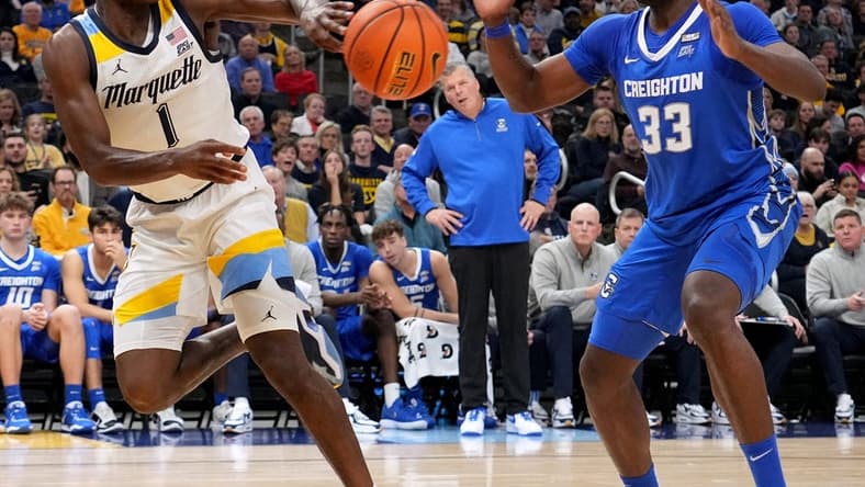 Marquette guard Kam Jones (1) keeps the ball inbounds flinging it past Creighton center Fredrick King (33) during the second half of their game Friday, December 16, 2022 at Fiserv Forum in Milwaukee, Wis. Marquette beat Creighton 69-58.
Mumen16 17