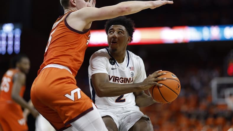 Jan 18, 2023; Charlottesville, Virginia, USA; Virginia Cavaliers guard Reece Beekman (2) drives to the basket as Virginia Tech Hokies guard Sean Pedulla (3) defends in the second half at John Paul Jones Arena. Mandatory Credit: Geoff Burke-USA TODAY Sports