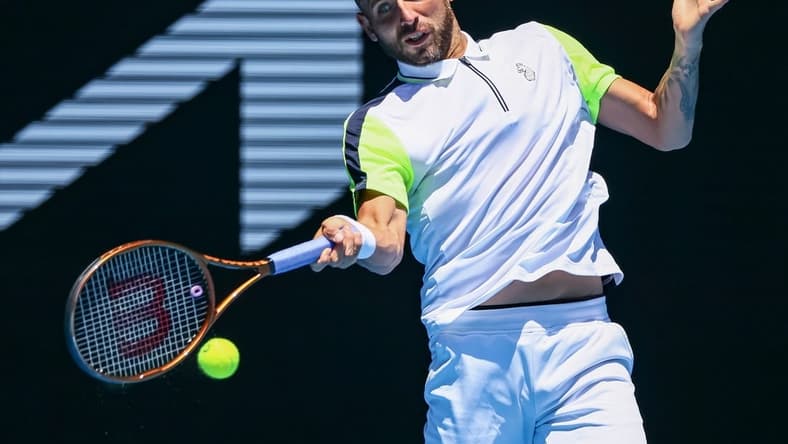 Jan 21, 2023; Melbourne, VICTORIA, Australia; Daniel Evans from Great Britain during his third round match against Andrey Rublev from Russia on day six of the 2023 Australian Open tennis tournament at Melbourne Park. Mandatory Credit: Mike Frey-USA TODAY Sports