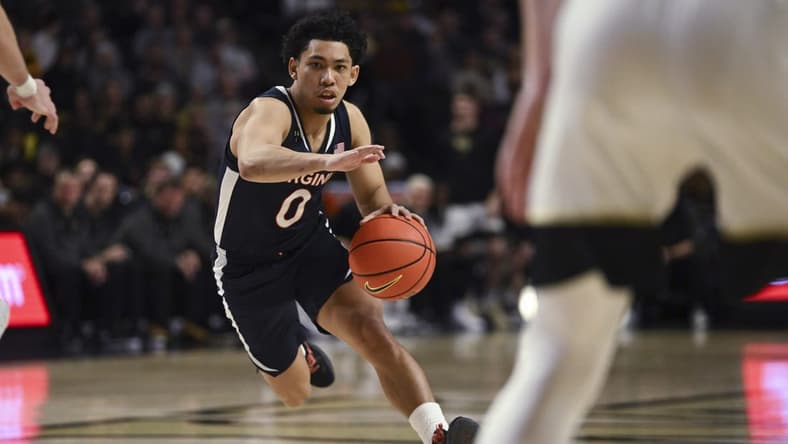 Jan 21, 2023; Winston-Salem, North Carolina, USA; Virginia Cavaliers guard Kihei Clark (0) drives into an opening in the Wake Forest Demon Deacons defense during the second half at Lawrence Joel Veterans Memorial Coliseum. Mandatory Credit: William Howard-USA TODAY Sports
