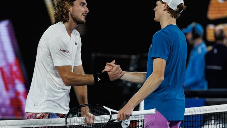 Jan 22, 2023; Melbourne, Victoria, Australia;  Stefanos Tsitsipas of Greece shakes hands with Jannik Sinner of Italy after beating him on day seven of the 2023 Australian Open tennis tournament at Melbourne Park. Mandatory Credit: Mike Frey-USA TODAY Sports
