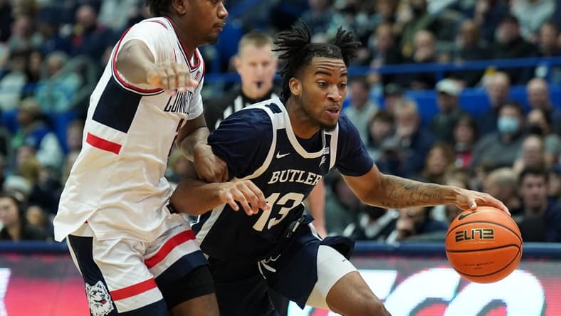 Jan 22, 2023; Hartford, Connecticut, USA; Butler Bulldogs guard Jayden Taylor (13) drives the ball against UConn Huskies guard Hassan Diarra (5) in the second half at XL Center. Mandatory Credit: David Butler II-USA TODAY Sports
