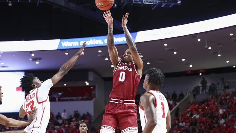 Jan 22, 2023; Houston, Texas, USA; Temple Owls guard Khalif Battle (0) shoots the ball as Houston Cougars guard Terrance Arceneaux (23) defends during the first half at Fertitta Center. Mandatory Credit: Troy Taormina-USA TODAY Sports