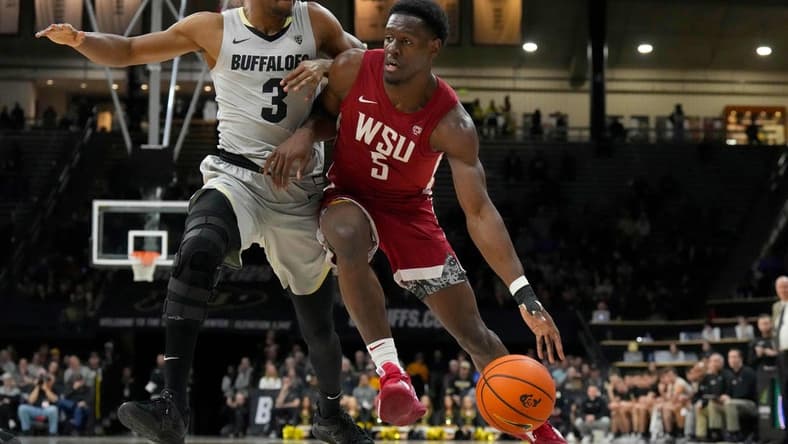 Jan 22, 2023; Boulder, Colorado, USA; Washington State Cougars guard TJ Bamba (5) drives at Colorado Buffaloes guard Jalen Gabbidon (3) in the second half at the CU Events Center. Mandatory Credit: Ron Chenoy-USA TODAY Sports